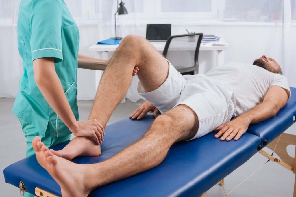 Knee Pain That Won’t Go Away: When to See a Physical Therapist in Indianapolis 4 partial view of female massage therapist doing mas 2022 11 02 03 51 12 utc min min